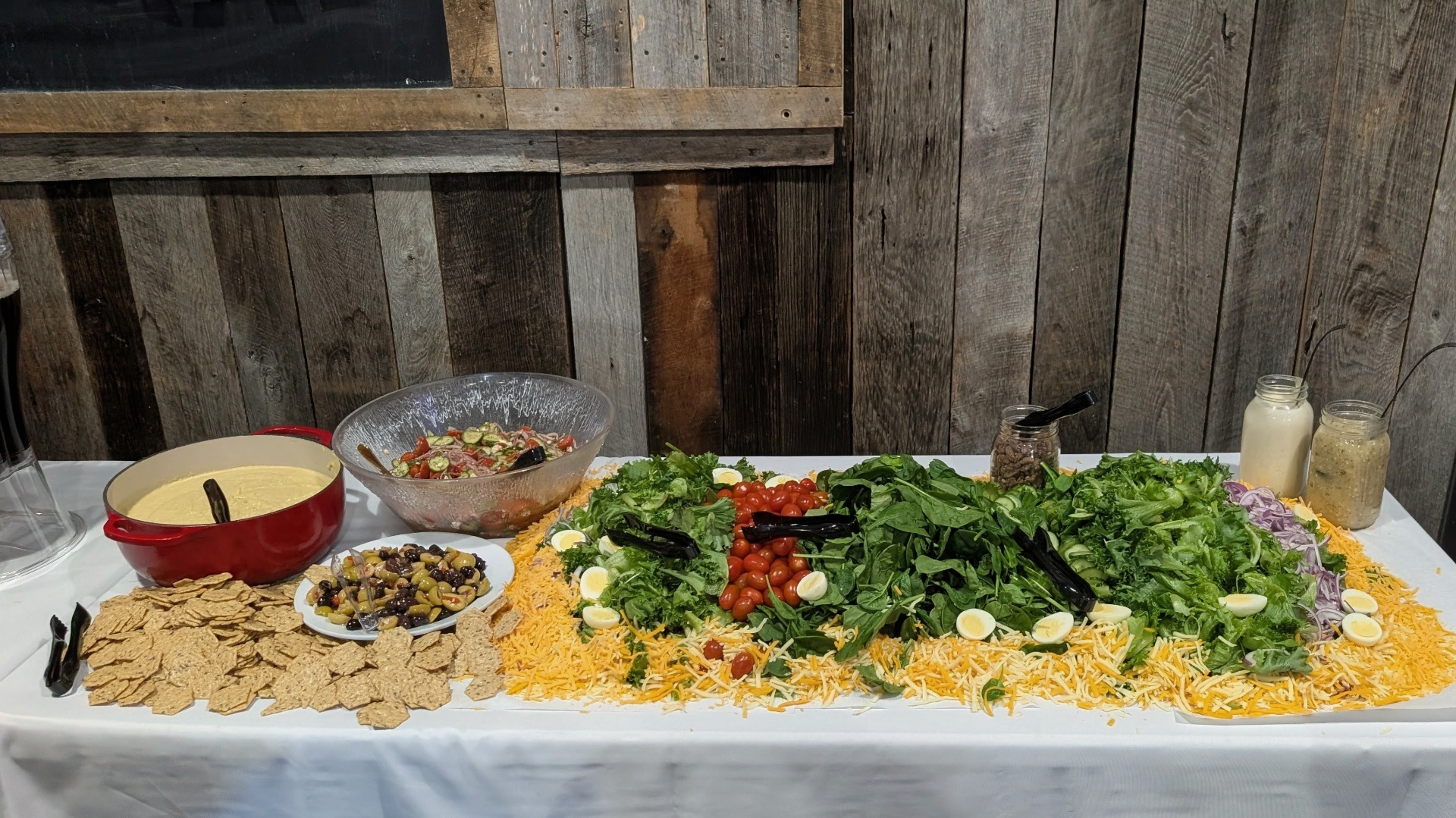 Wide angle of the gluten-free chopped salad runner with hummus, olive medley, and tomato cucumber salad